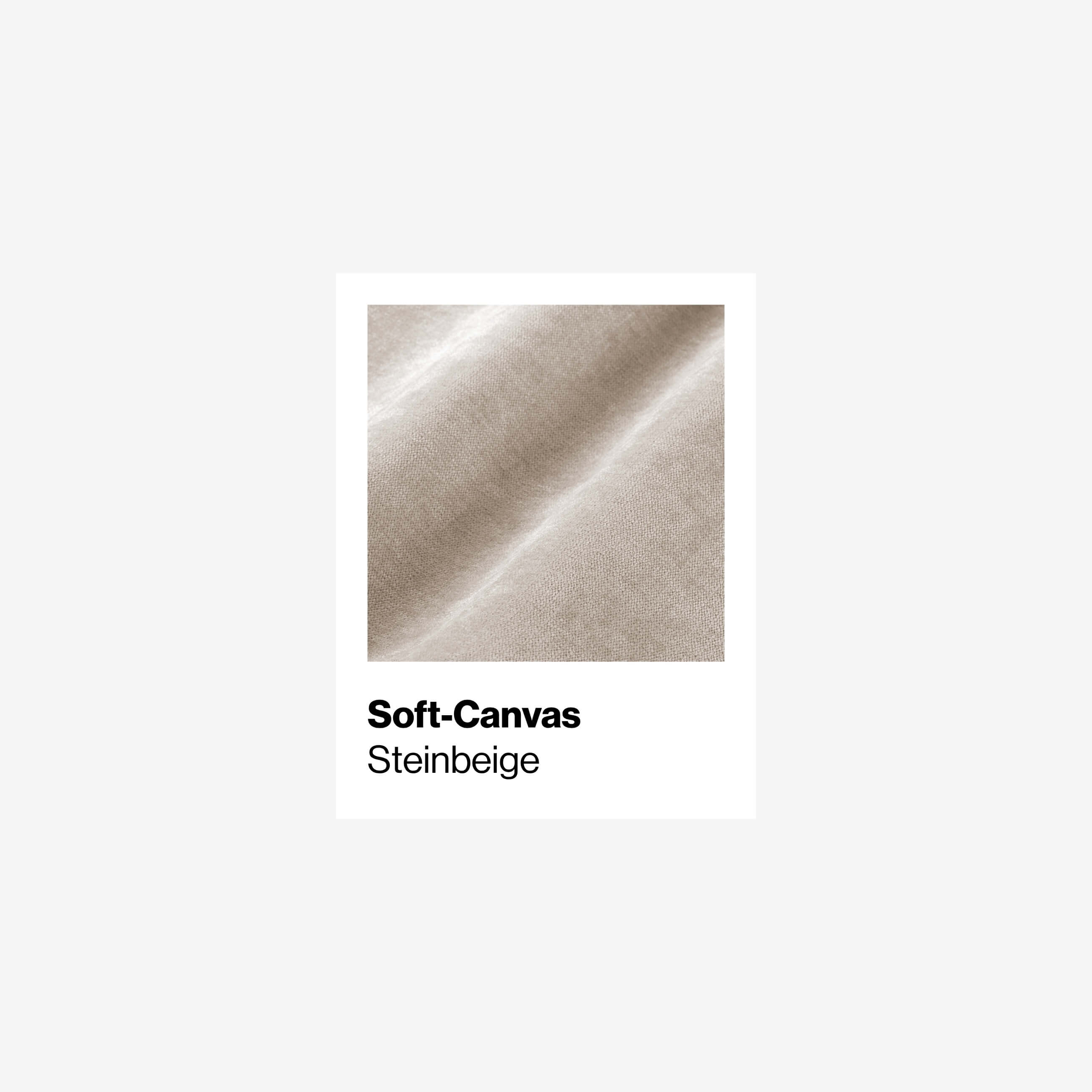 Nahaufnahme eines beigen Soft-Canvas-Stoffes mit sichtbarer Textur und sanften Falten. Der Text unter dem Bild lautet Soft-Canvas Steinbeige auf weißem Hintergrund.